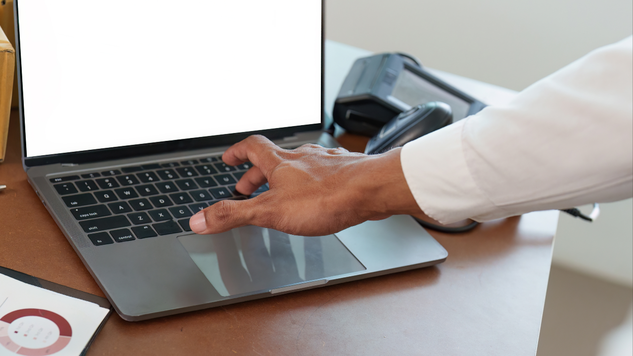 Business owner setting up an online store on a laptop